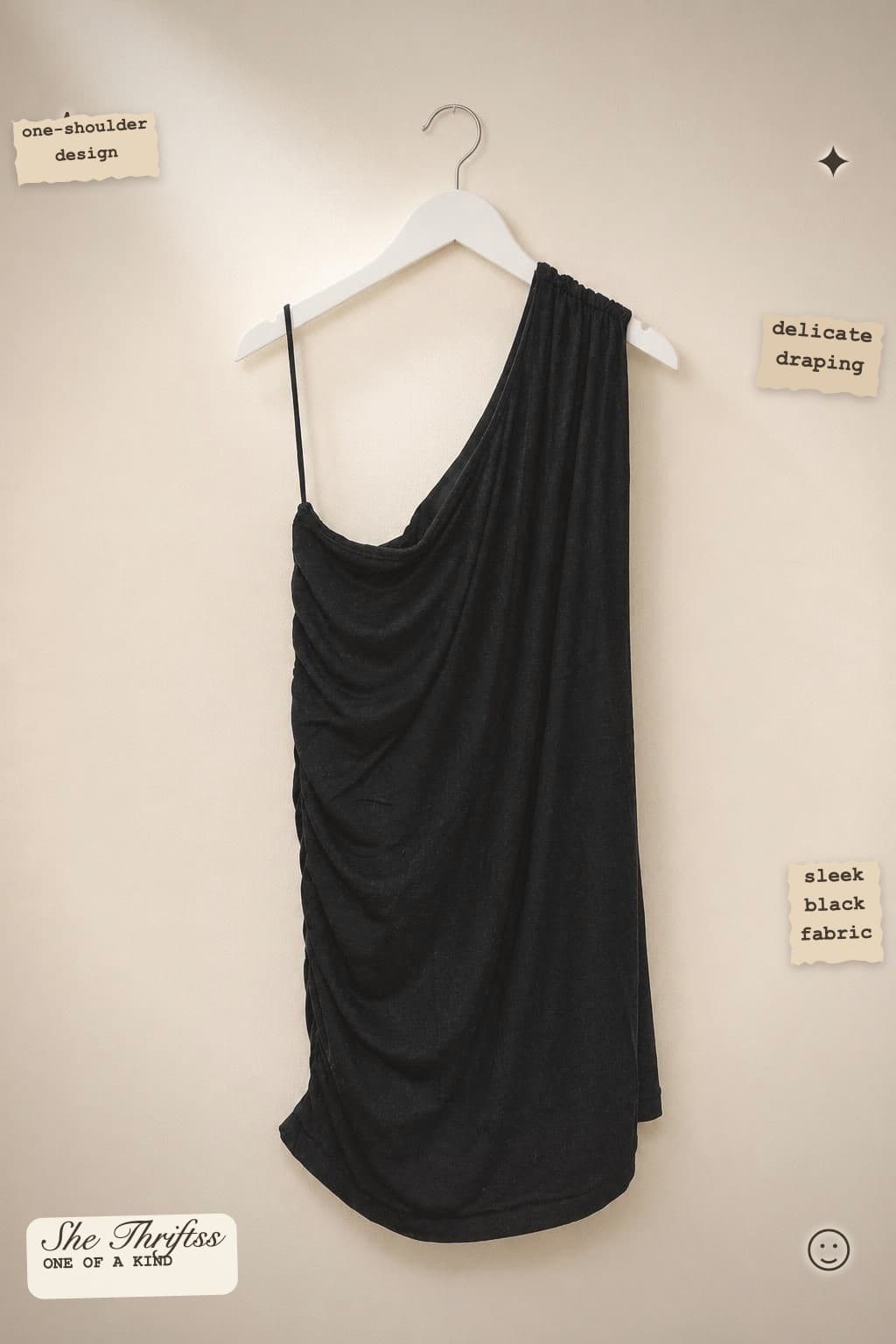Black one-shoulder draped top
